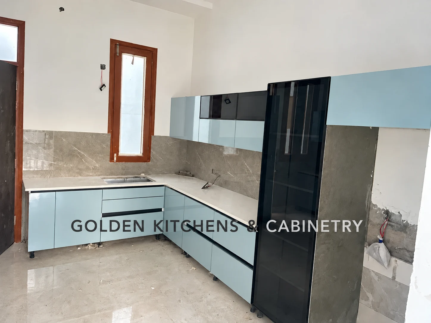 Pale blue kitchen during installation