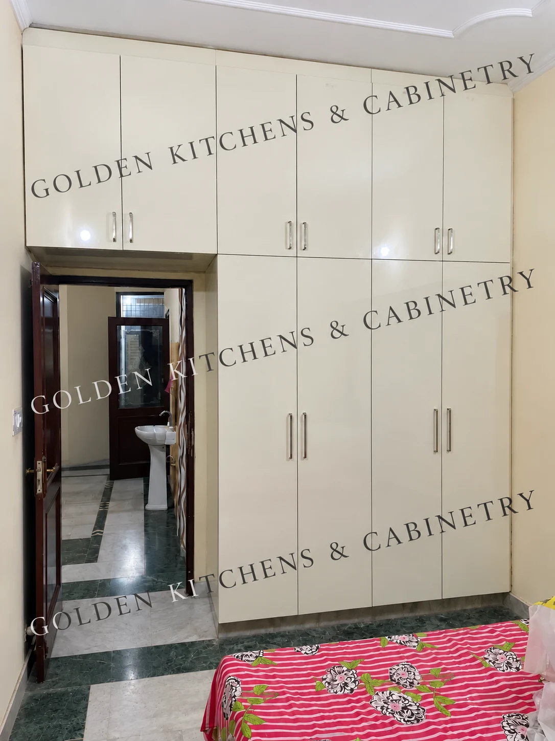 White cabinetry surrounding a bedroom doorway